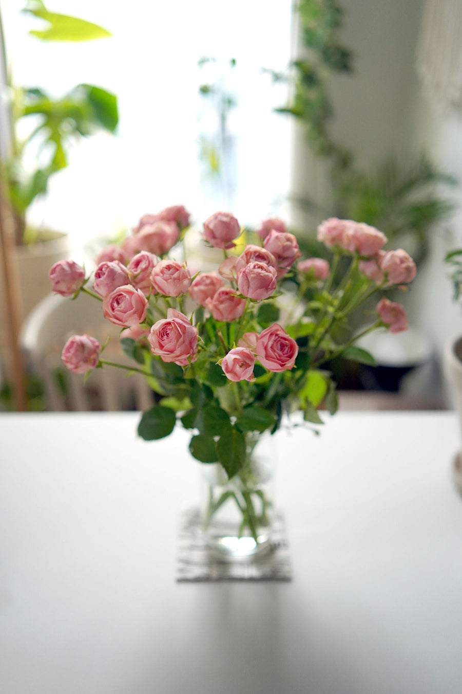 Pink rose bouquet in a clear vase