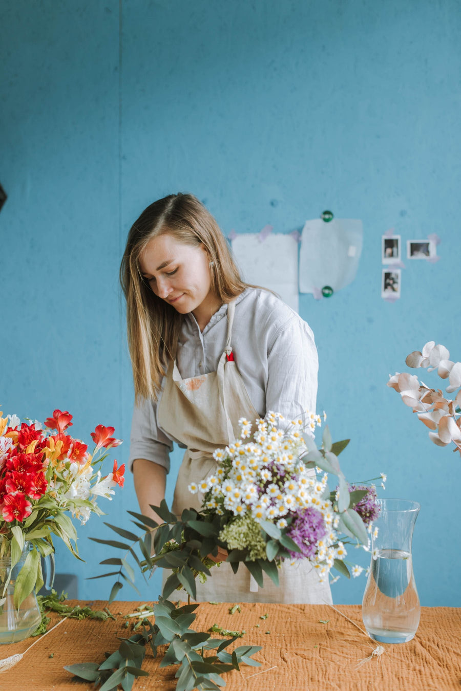 Trimming flower stems before arranging a bouquet