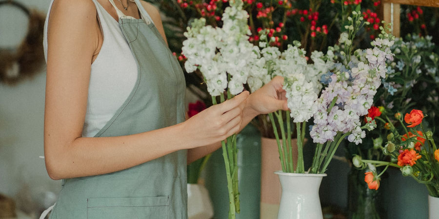 A florist selecting stems for an arrangement