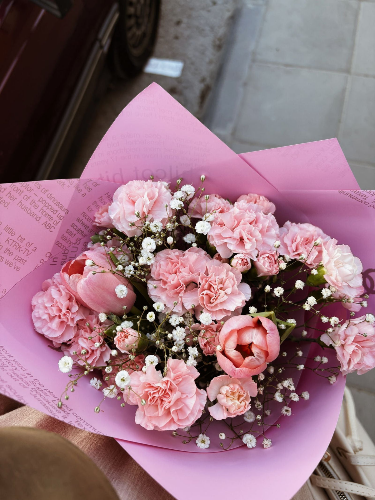 Pink carnations and tulips in a bouquet