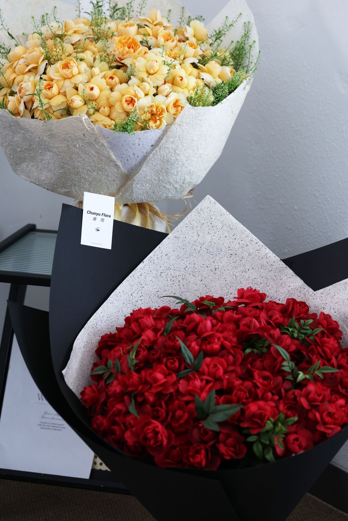 Coordinated rose bouquets in modern wrapping