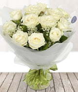 ivory 12. Reference florist photograph; final Luma packaging may differ; photograph represents the named stem-count variant only.