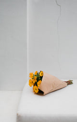 Wrapped flowers against a light white backdrop; illustrative wrapping presentation, not the exact Luma wrapping set contents. Photo: Rachel Claire / Pexels.